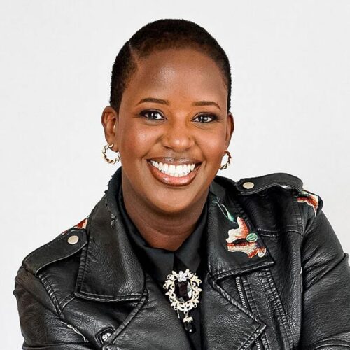 Ornella smiles in a nice jacket.