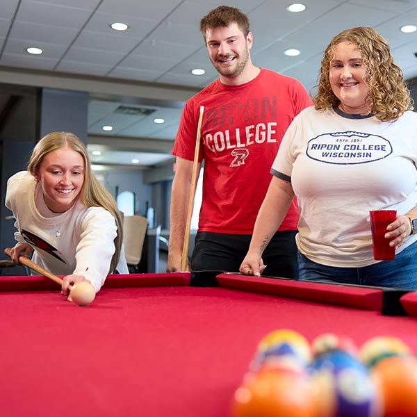 Students aim at billiards in the Spot.