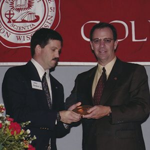 Huebner accepts award on stage
