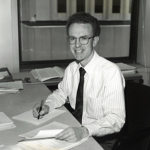 Reinecke sits at a desk