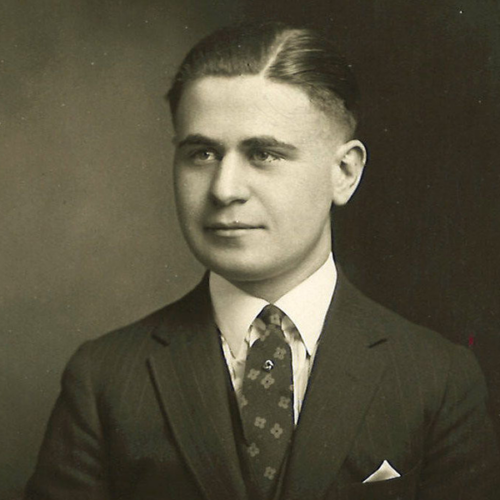 Reisz in a suit and tie