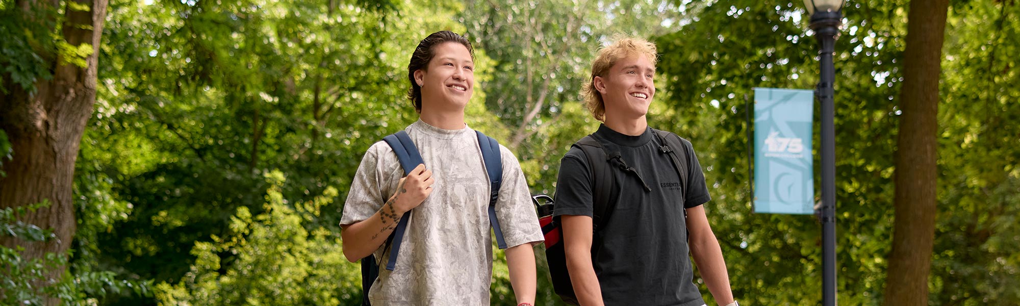 Students walk in some of the many wooded areas around campus