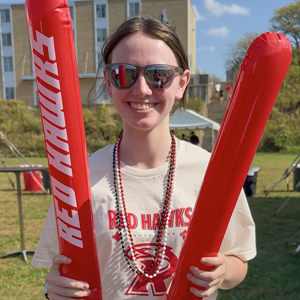 Red Hawk with noisemakers ready to cheer during Homecoming