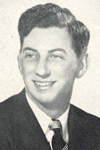 Trainer in a suit and tie