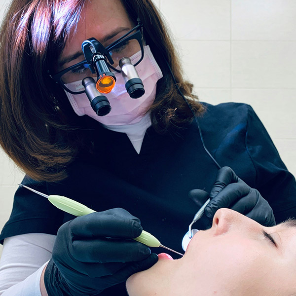 A dentist looking in mouth