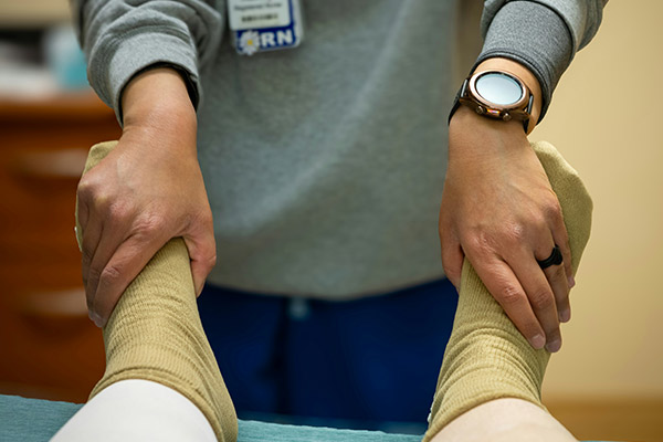 RN with patient-Photo by Judy Beth Morris on Unsplash