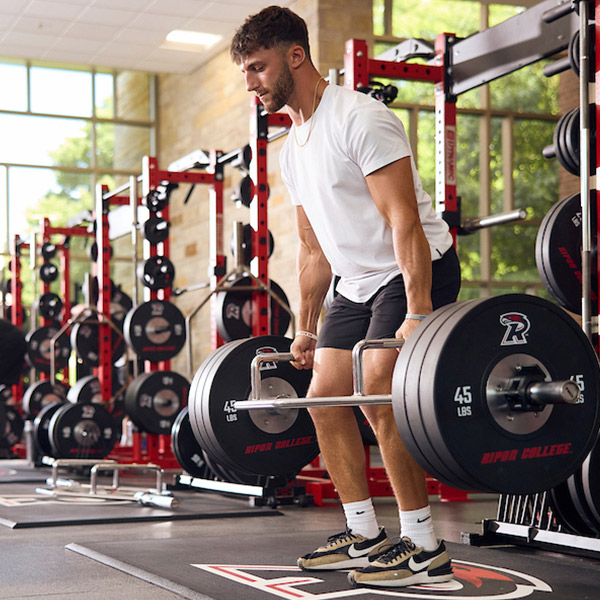 A student deadlifts in the Willmore Center