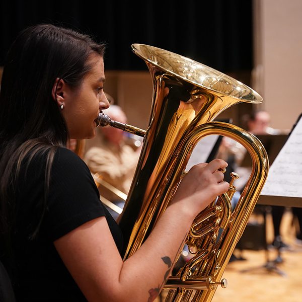 Ripon College student playing a tuba on stage in Demmer Recital Hall